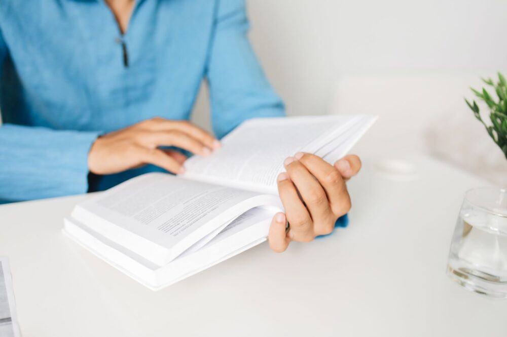 close up shot of a person reading a book